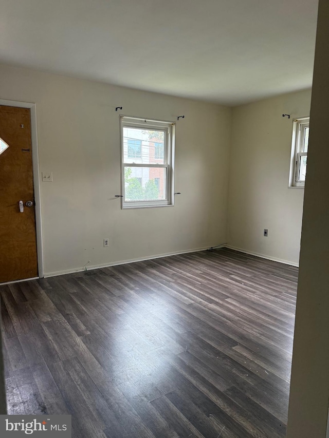 5119 19th St N, Arlington, VA 22207 - empty room with dark wood-type flooring and baseboards