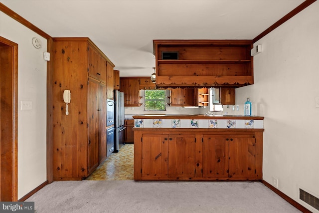kitchen featuring open shelves, freestanding refrigerator, baseboards, and brown cabinetry