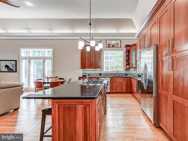 26 Bellchase Ct Unit B, Pikesville, MD 21208 - kitchen featuring stainless steel appliances, a sink, a breakfast bar, and light wood-type flooring