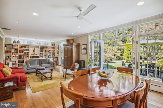 sunroom / solarium featuring a healthy amount of sunlight and visible vents