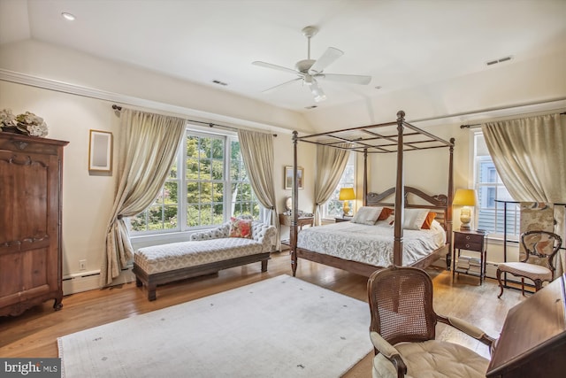 bedroom featuring vaulted ceiling, wood finished floors, visible vents, and recessed lighting