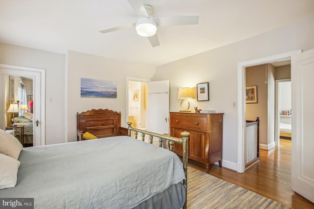 bedroom with ceiling fan, baseboards, and wood finished floors