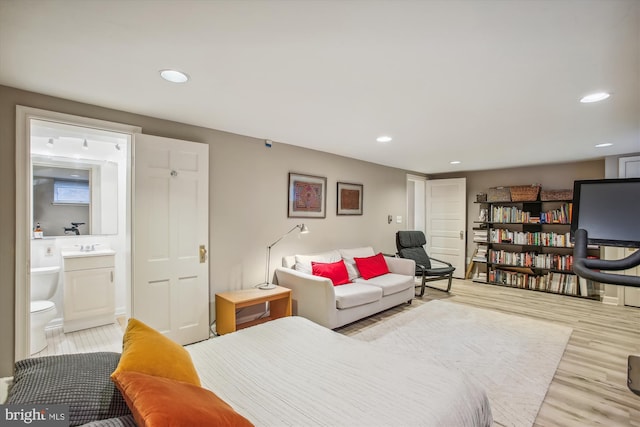 living room featuring light wood-type flooring and recessed lighting