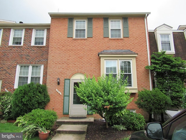 view of property with brick siding
