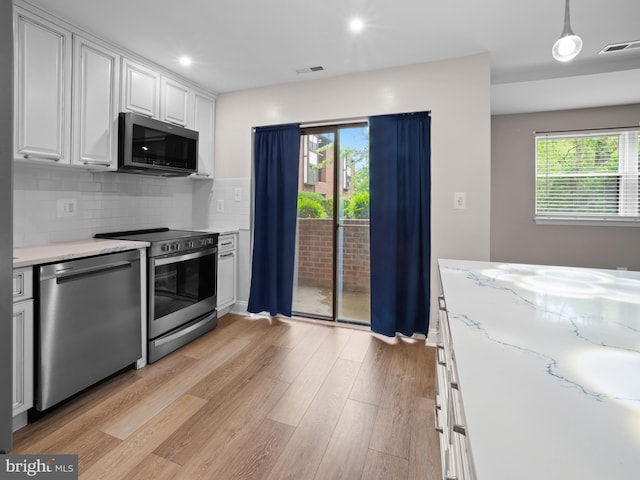 kitchen featuring plenty of natural light, visible vents, and appliances with stainless steel finishes