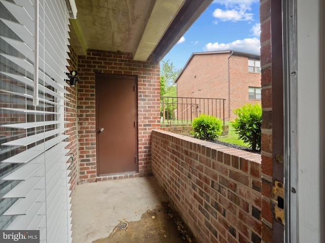 exterior space featuring brick siding