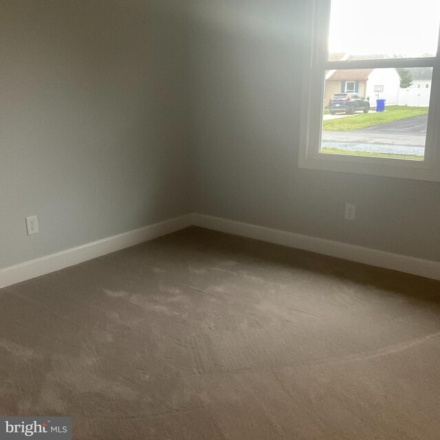 54 Bryan Dr, Rehoboth Beach, DE 19971 - carpeted empty room featuring baseboards