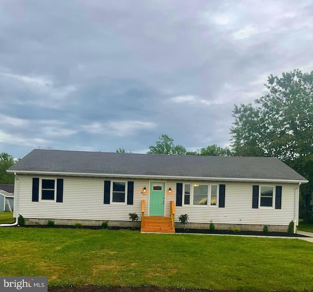 54 Bryan Dr, Rehoboth Beach, DE 19971 - view of front facade featuring a shingled roof and a front lawn