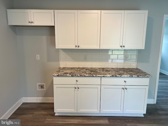 54 Bryan Dr, Rehoboth Beach, DE 19971 - kitchen featuring baseboards, dark stone countertops, white cabinets, and backsplash