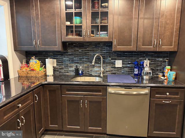 10282 Greystone Rd, Manassas, VA 20111 - kitchen featuring stainless steel dishwasher, dark brown cabinetry, and dark stone counters