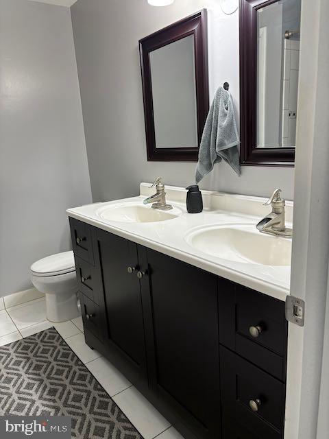 10282 Greystone Rd, Manassas, VA 20111 - bathroom with double vanity and tile patterned floors