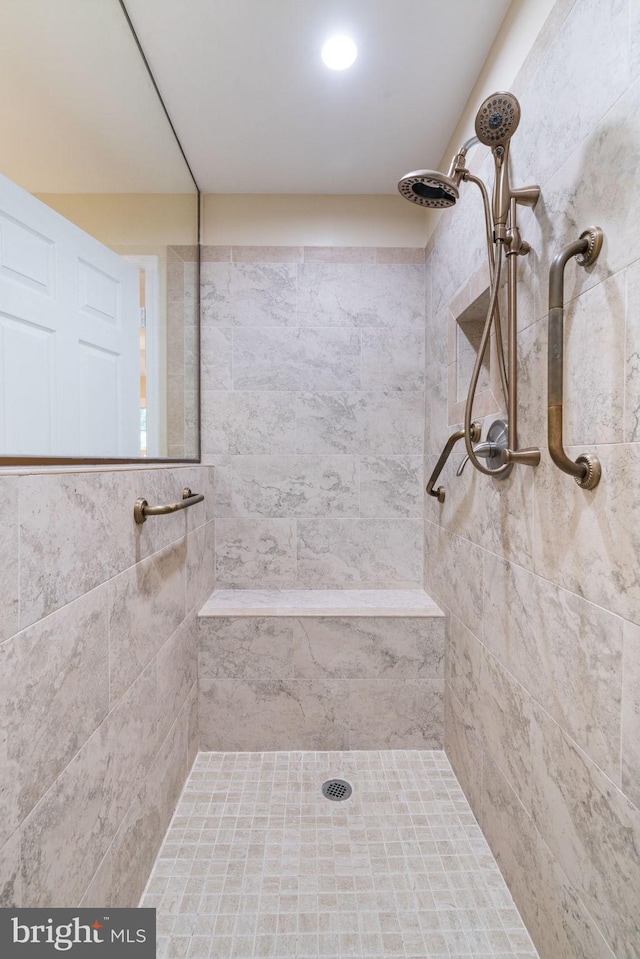 full bath with a tile shower