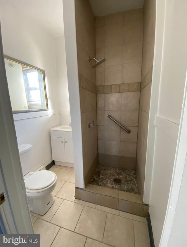 2718 W Sterner St, Philadelphia, PA 19132 - full bathroom with vanity, toilet, a shower stall, and tile patterned floors