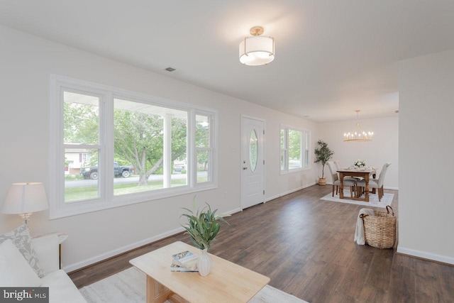 108 Wesley Chapel Dr, Edinburg, VA 22824 - living area with a chandelier, wood finished floors, and baseboards