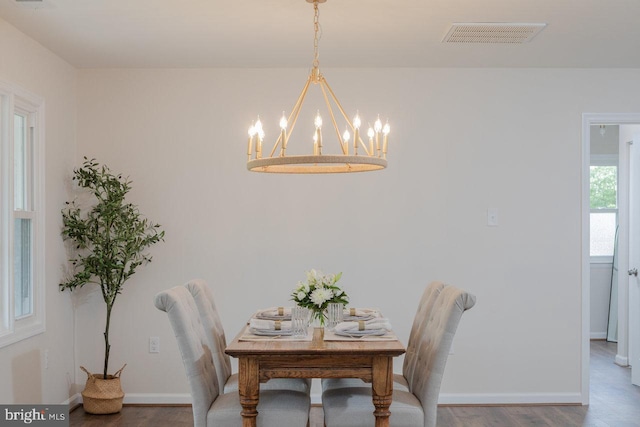 108 Wesley Chapel Dr, Edinburg, VA 22824 - dining area featuring a chandelier, wood finished floors, and baseboards