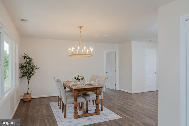 108 Wesley Chapel Dr, Edinburg, VA 22824 - dining space with dark wood finished floors, a chandelier, healthy amount of natural light, and baseboards