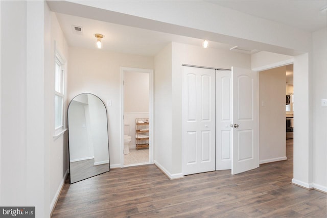 108 Wesley Chapel Dr, Edinburg, VA 22824 - unfurnished bedroom featuring wood finished floors, a closet, baseboards, and ensuite bath