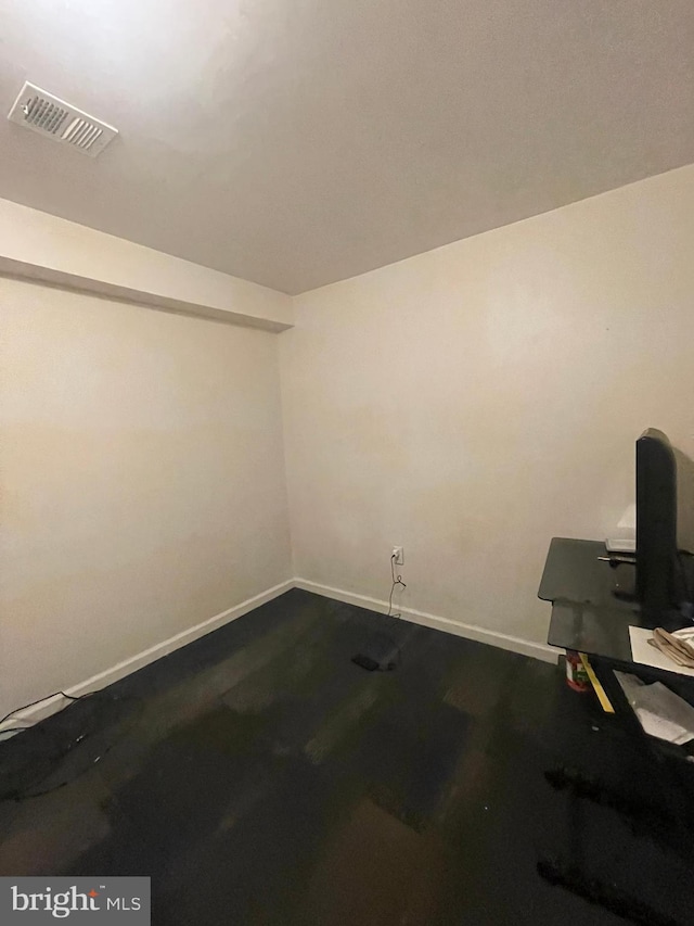 interior space featuring baseboards and visible vents
