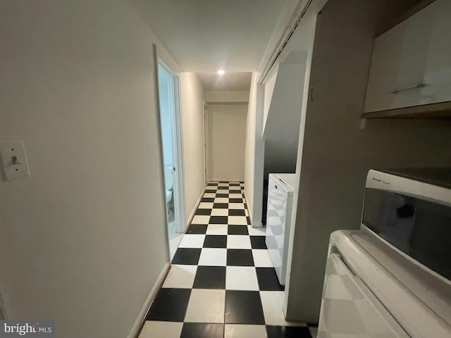 hall with recessed lighting and tile patterned floors