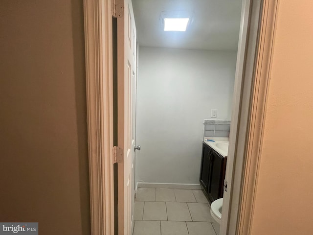 bathroom with tile patterned floors, vanity, and toilet