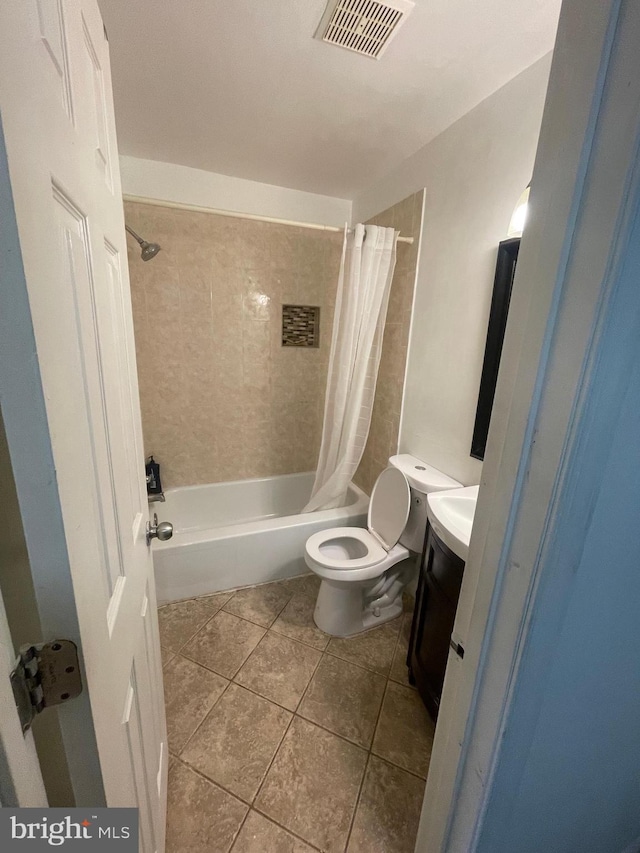 full bath featuring visible vents, tile patterned flooring, vanity, toilet, and shower / bath combo with shower curtain