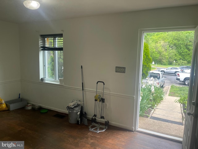 entrance foyer featuring wood-type flooring, baseboards, and visible vents