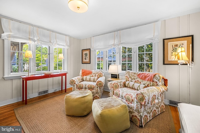 sunroom featuring healthy amount of natural light and french doors