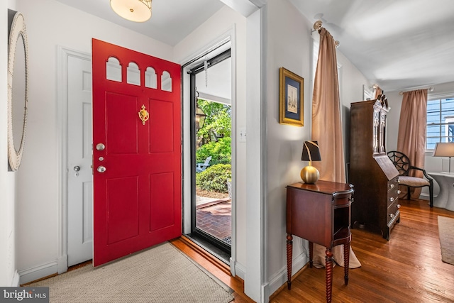 entrance foyer featuring wood finished floors and baseboards
