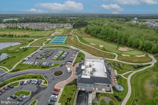 bird's eye view with a water view and view of golf course