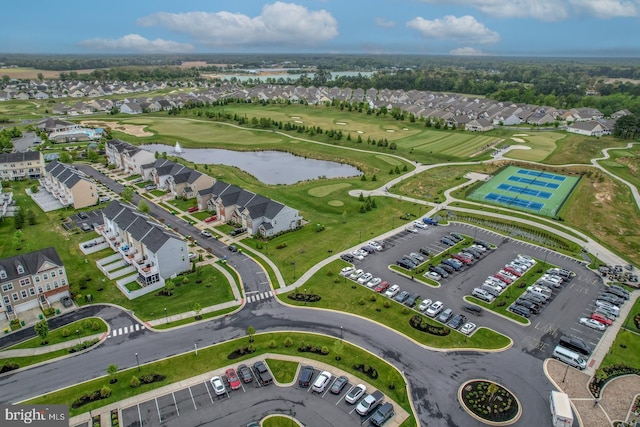 aerial view featuring a water view, golf course view, and a residential view