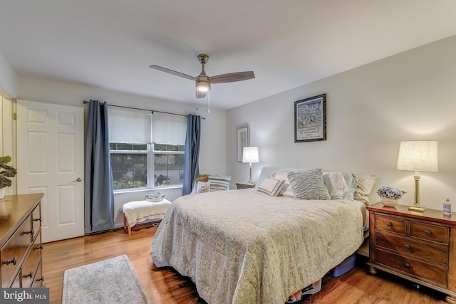 bedroom with ceiling fan and light wood-type flooring