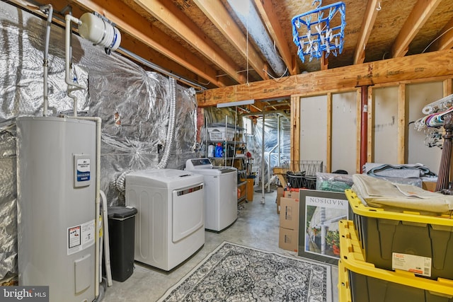 unfinished below grade area featuring independent washer and dryer and water heater
