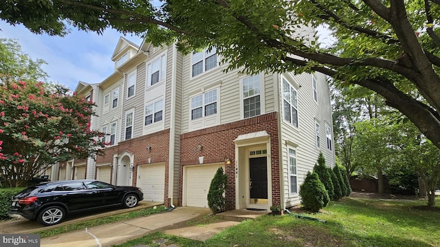 11441 Log Ridge Dr, Fairfax, VA 22030 - view of front of house featuring an attached garage, brick siding, and driveway