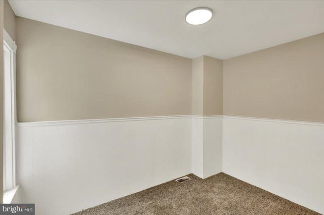 472 Atlantic Ave, Lancaster, PA 17602 - unfurnished room featuring carpet flooring, a wainscoted wall, and visible vents