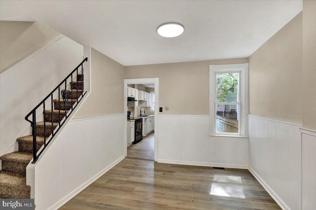 472 Atlantic Ave, Lancaster, PA 17602 - interior space featuring stairway, wainscoting, and wood finished floors