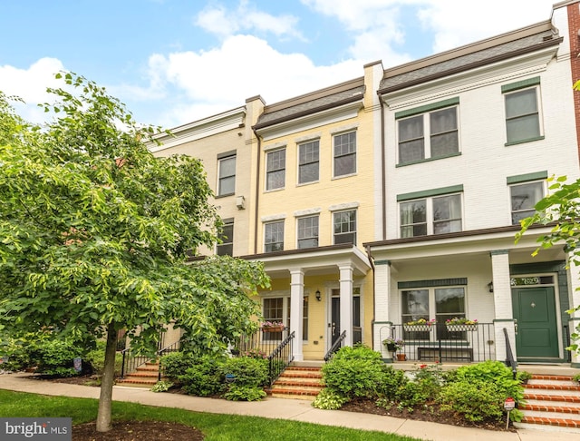 631 Regent Pl NE, Washington, DC 20017 - multi unit property featuring a porch and brick siding
