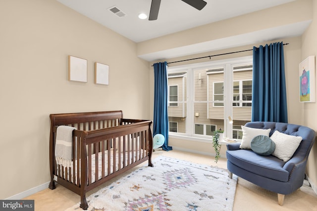 631 Regent Pl NE, Washington, DC 20017 - carpeted bedroom with baseboards, ceiling fan, and a crib