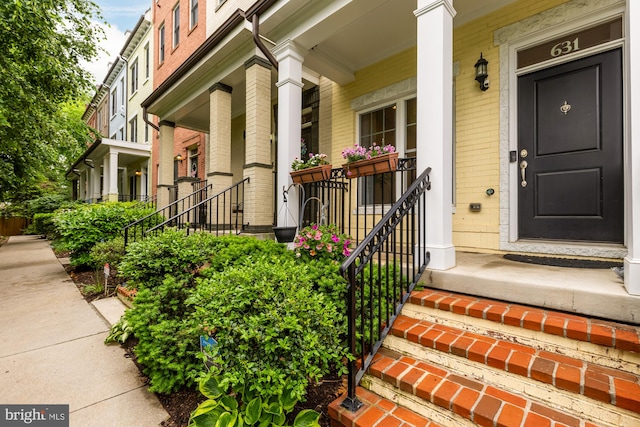 631 Regent Pl NE, Washington, DC 20017 - view of exterior entry featuring brick siding and covered porch