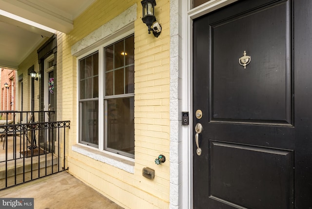 631 Regent Pl NE, Washington, DC 20017 - property entrance with a porch and brick siding