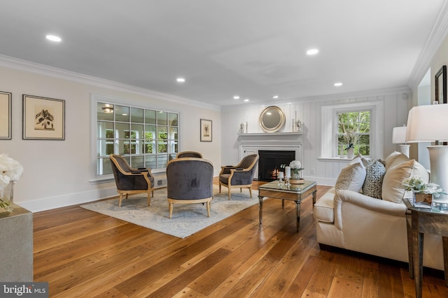 1409 Beaumont Dr, Gladwyne, PA 19035 - living area with crown molding, wood-type flooring, baseboards, a warm lit fireplace, and recessed lighting