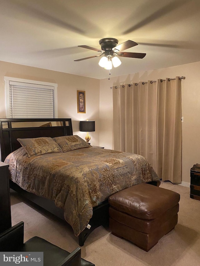 bedroom with ceiling fan and carpet flooring
