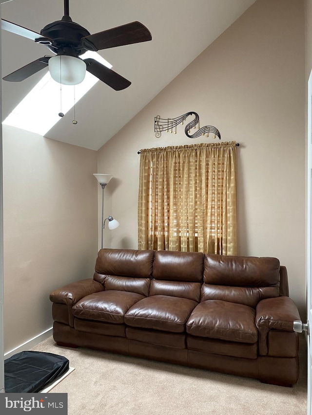 carpeted living area featuring a ceiling fan and lofted ceiling