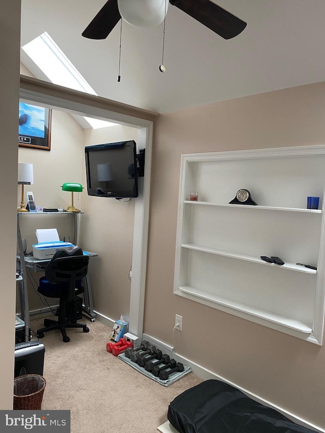 carpeted office featuring ceiling fan and baseboards