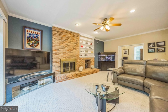 carpeted living area with ceiling fan, ornamental molding, a fireplace, and recessed lighting