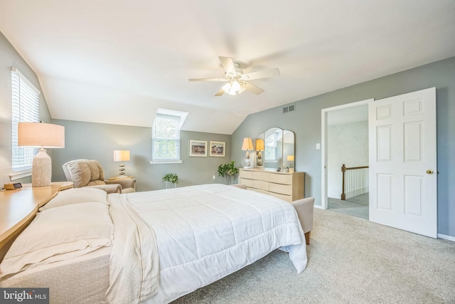 bedroom with carpet flooring, vaulted ceiling, ceiling fan, and baseboards