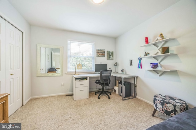 office space featuring light colored carpet and baseboards