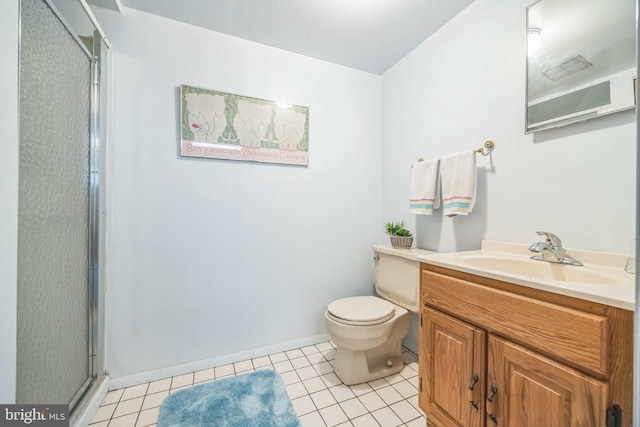 bathroom featuring a shower stall, toilet, tile patterned flooring, vanity, and baseboards