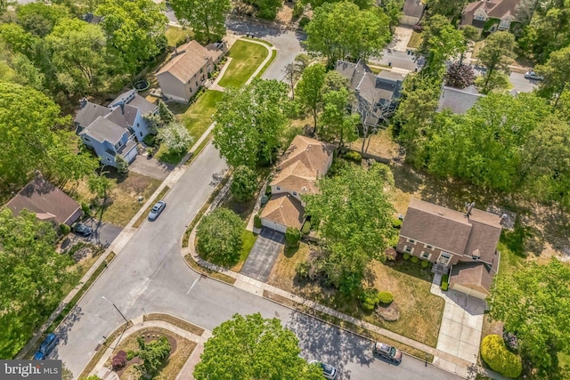 aerial view of property and surrounding area featuring nearby suburban area