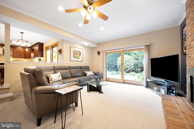 living room featuring light colored carpet, ceiling fan, recessed lighting, ornamental molding, and a brick fireplace