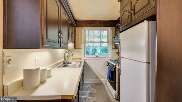 100 Lakeview Dr, Ridley Park, PA 19078 - kitchen with a sink, freestanding refrigerator, tile patterned flooring, gas range, and light countertops